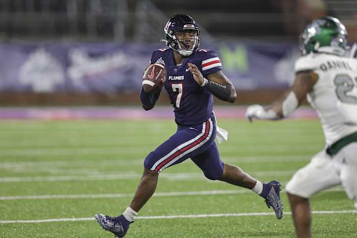 Liberty Flames quarterback Malik Willis (7) rolls out to pass against the Eastern Michigan Eagles in the third quarter during the 2021 LendingTree Bowl at Hancock Whitney Stadium.